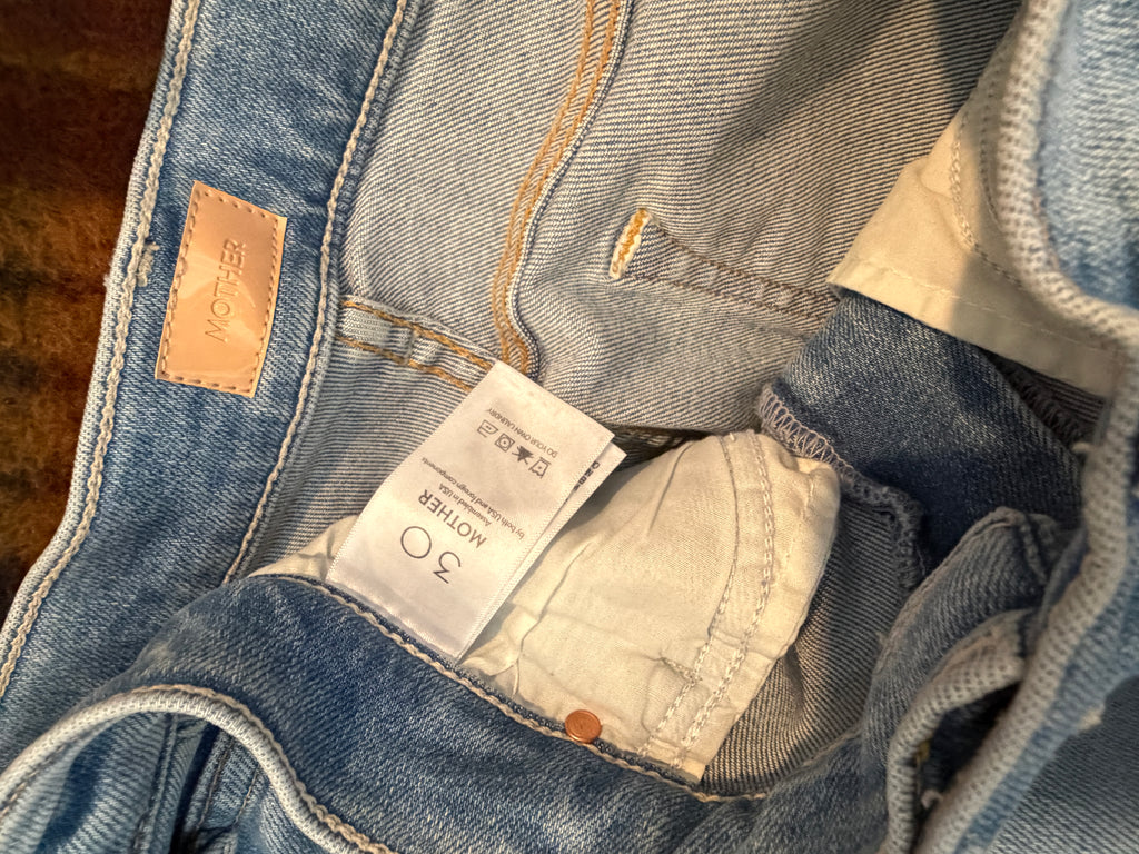 MOTHER Light Wash Cropped Bootcut Jeans — care label