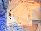 MOTHER Distressed Light Wash Boyfriend Jeans — care label