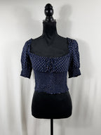 Reformation Polka Dot Tie-Front Puff-Sleeve Crop Top – Navy – front