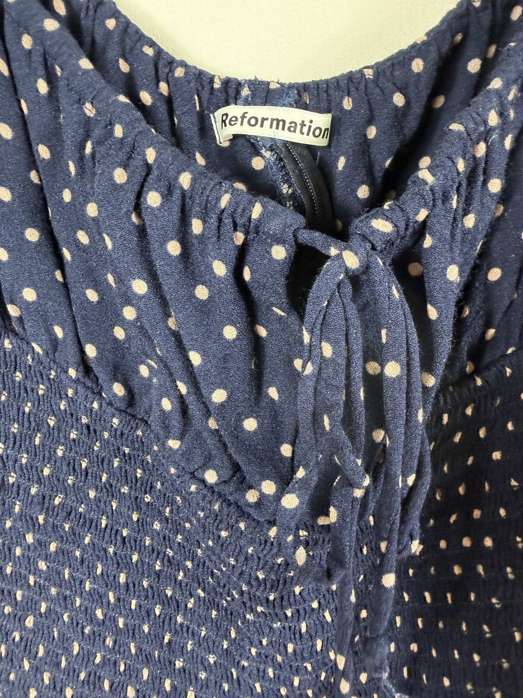 Reformation Polka Dot Tie-Front Puff-Sleeve Crop Top – Navy – label
